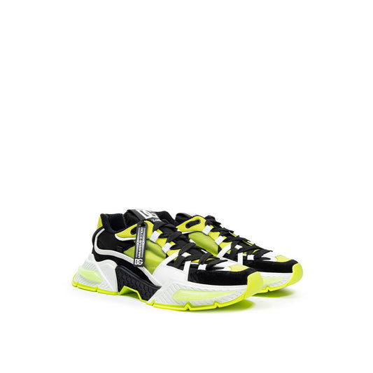Pair of yellow and black sneakers with white soles