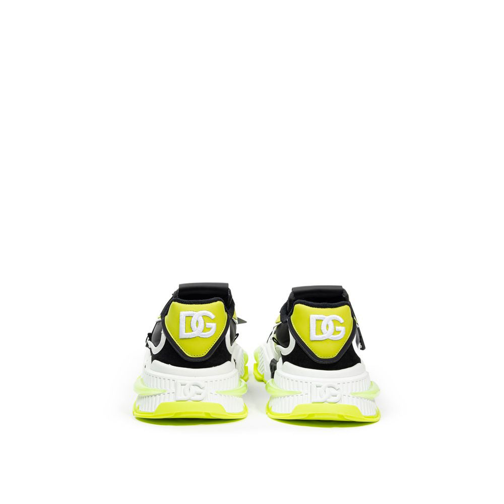 Pair of yellow and black sneakers with white soles