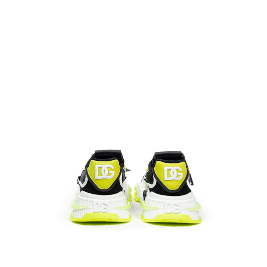 Pair of yellow and black sneakers with white soles
