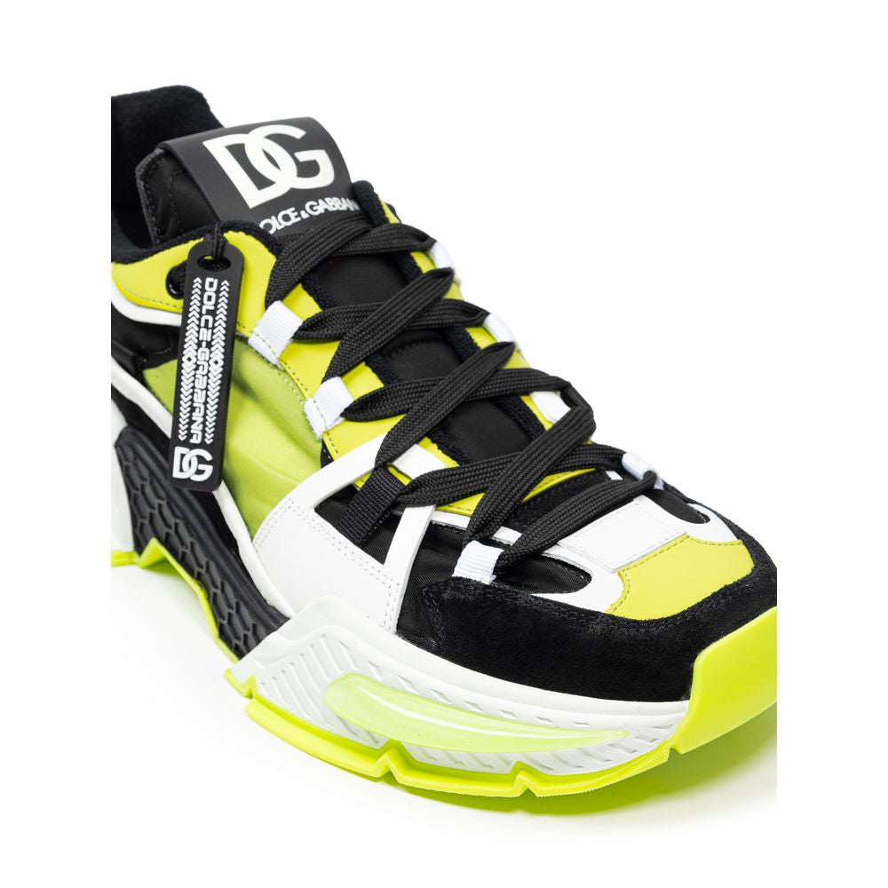 Black and yellow athletic shoe with white laces