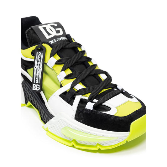 Black and yellow athletic shoe with white laces