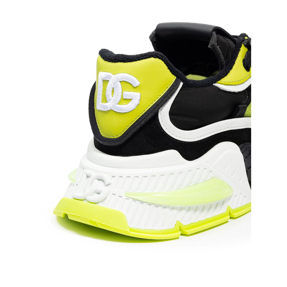 Yellow and black athletic shoe with white sole