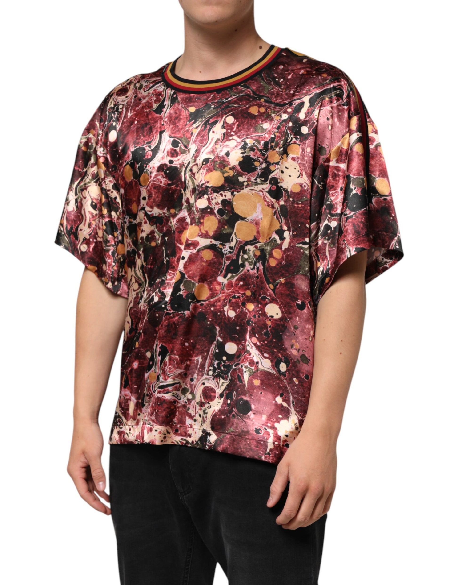 Man wearing a colorful shirt with red and black patterns