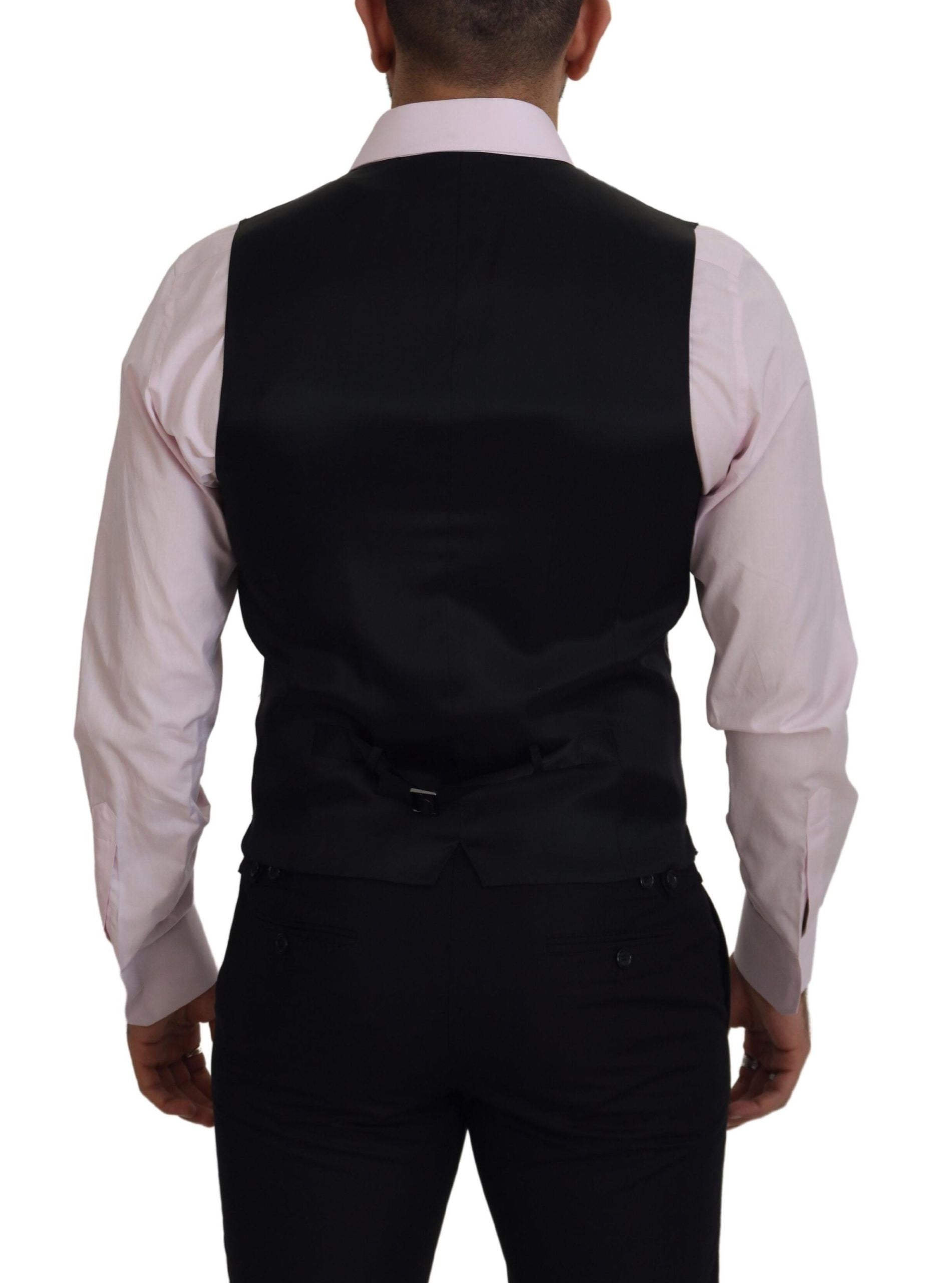 Black vest with white shirt and black pants