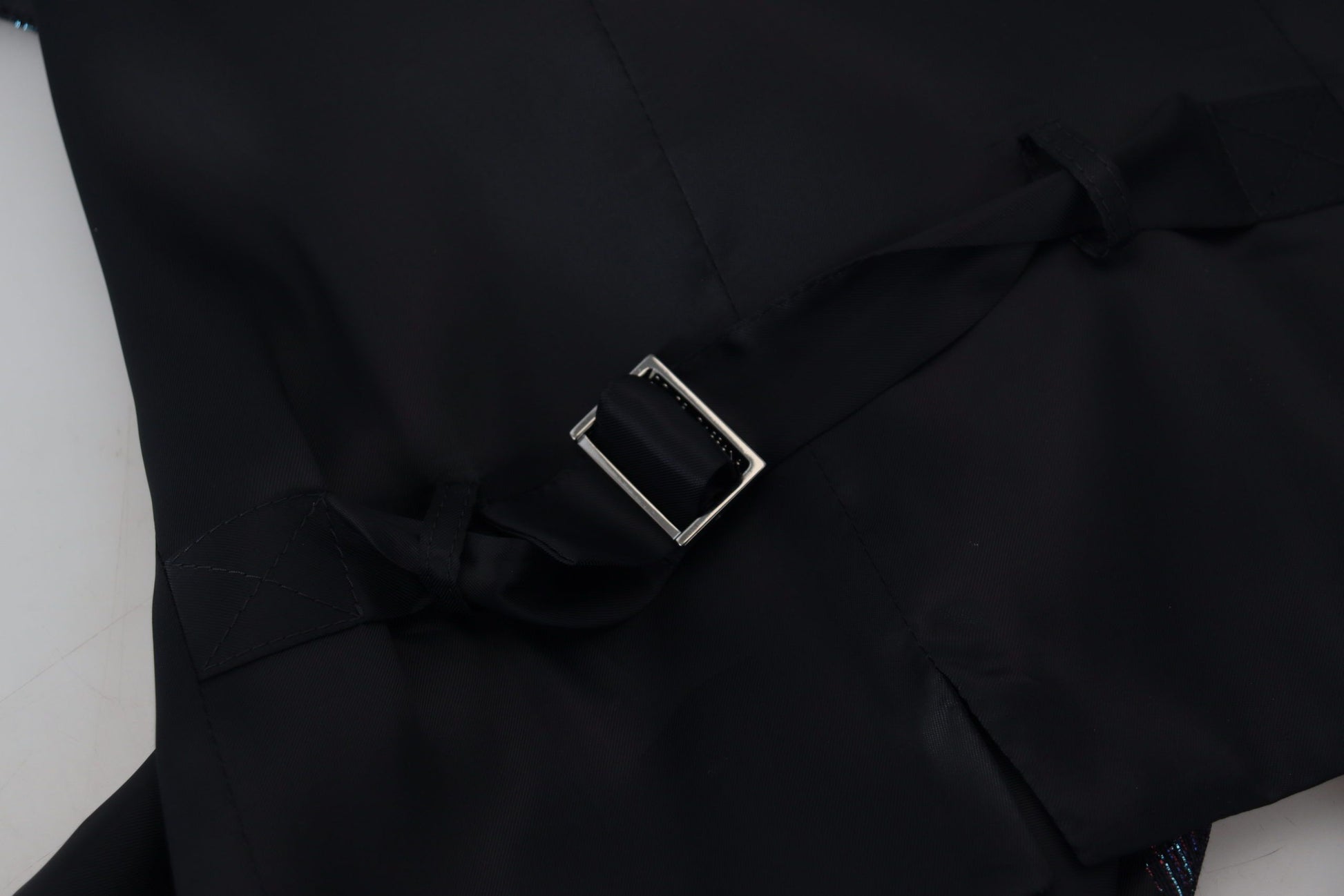 A black waistcoat with a silver buckle