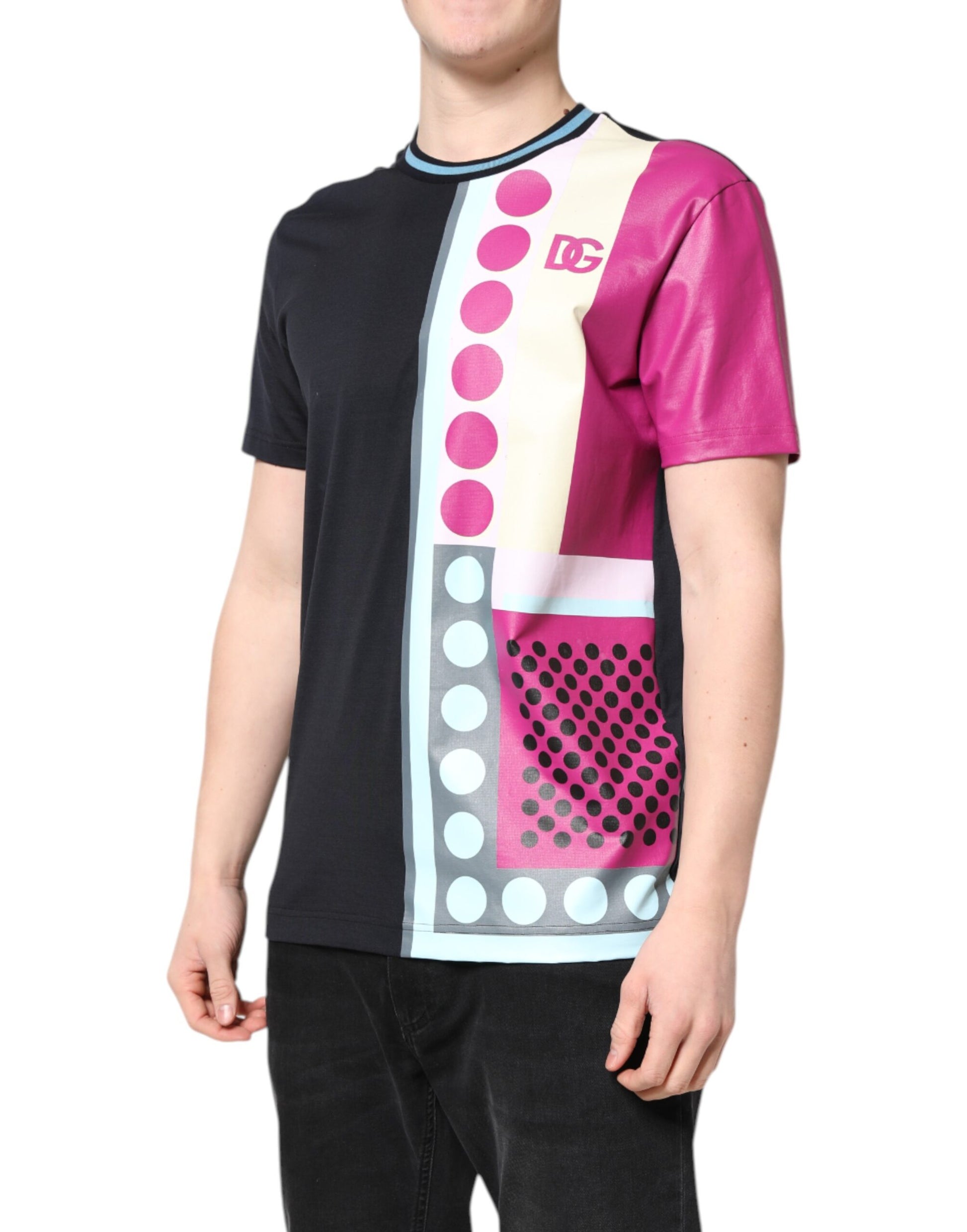 Man wearing a black shirt with pink and blue design on front