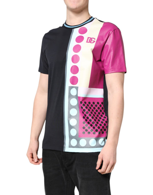 Man wearing a black shirt with pink and blue design on front