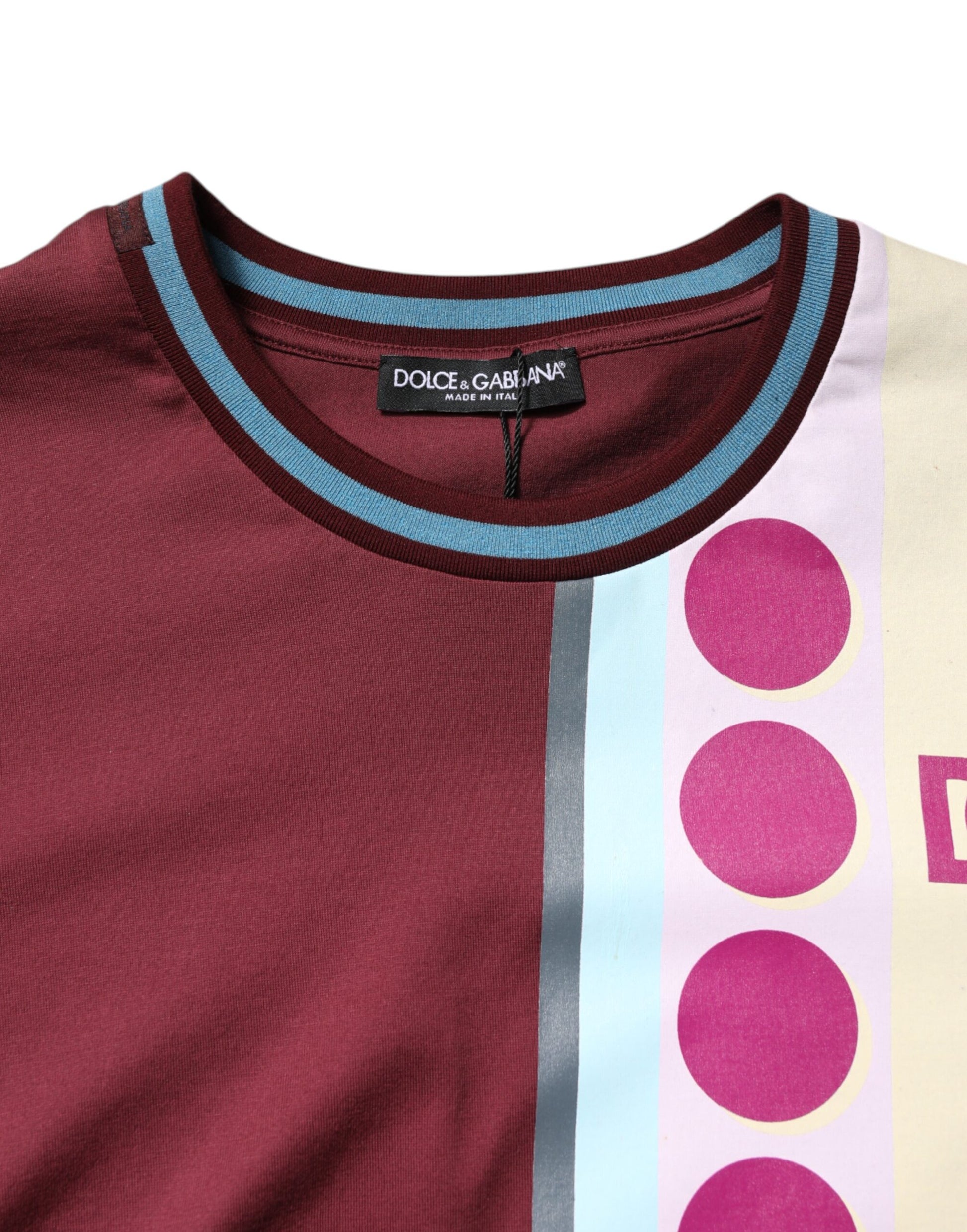 Maroon long sleeve shirt with blue trim and pink polka dots on front