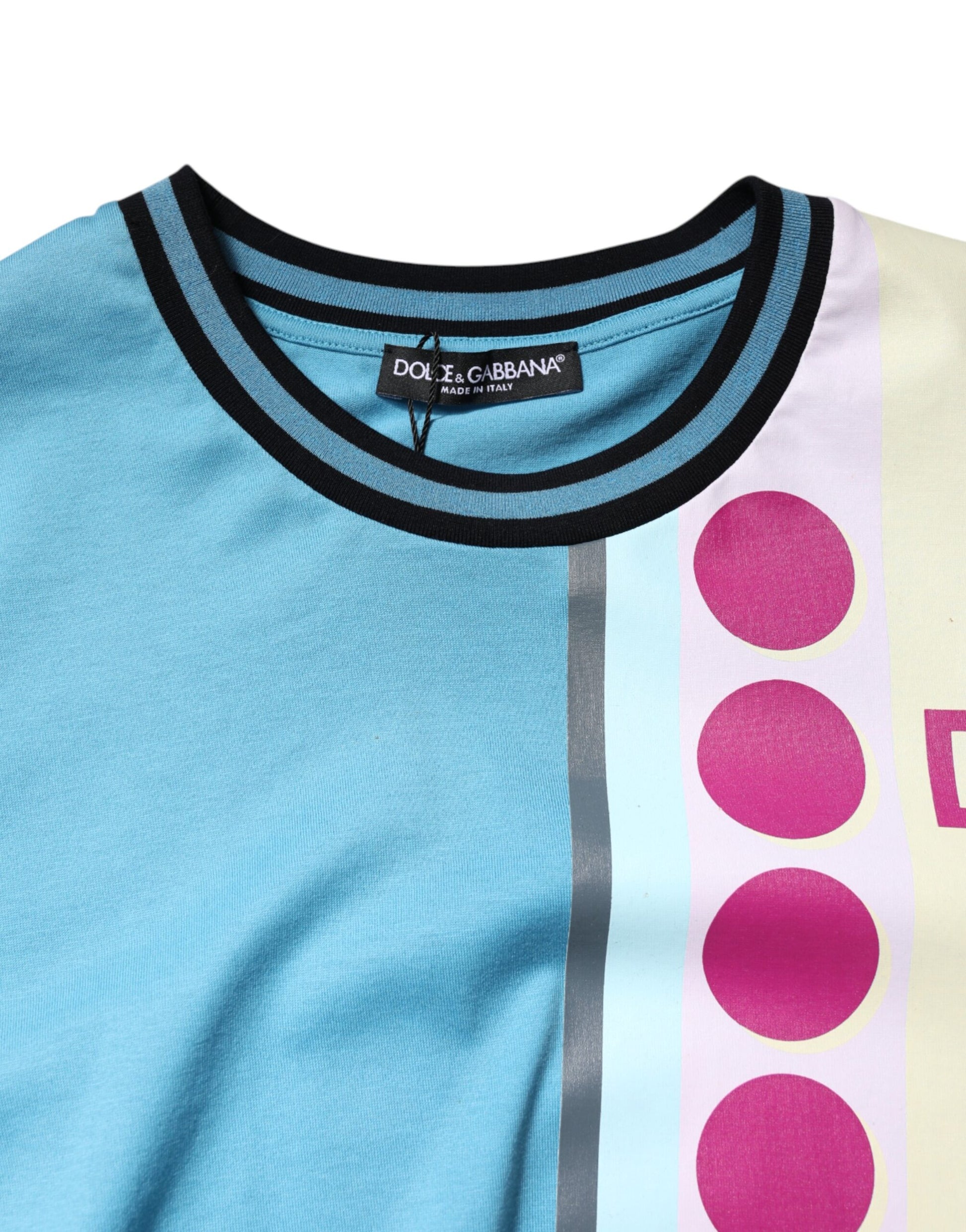 Blue shirt with pink polka dots on sleeve