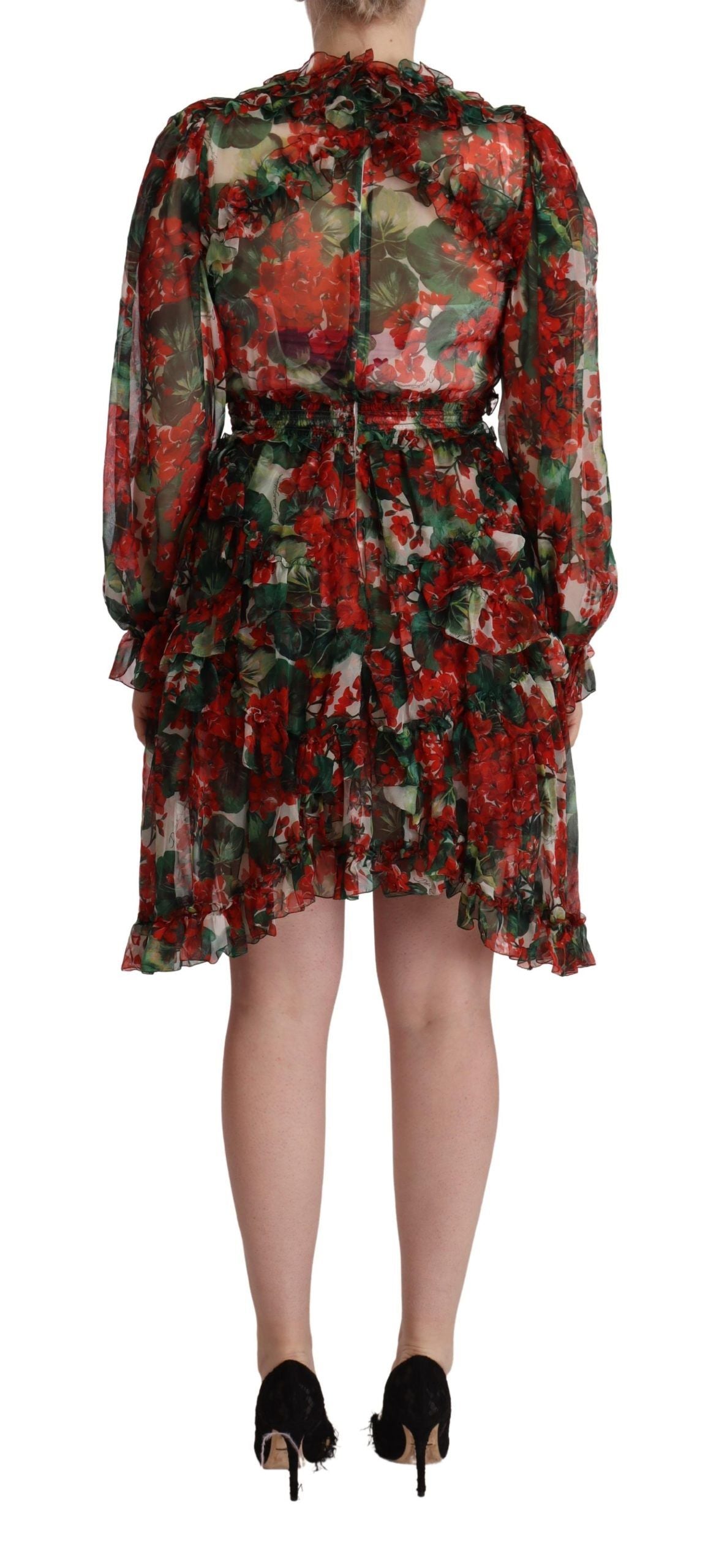 A long, floral patterned dress with a belt at the waist and a flared skirt