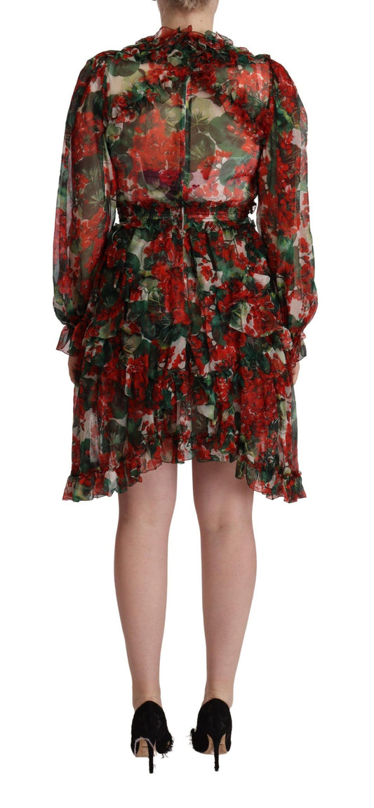A long, floral patterned dress with a belt at the waist and a flared skirt