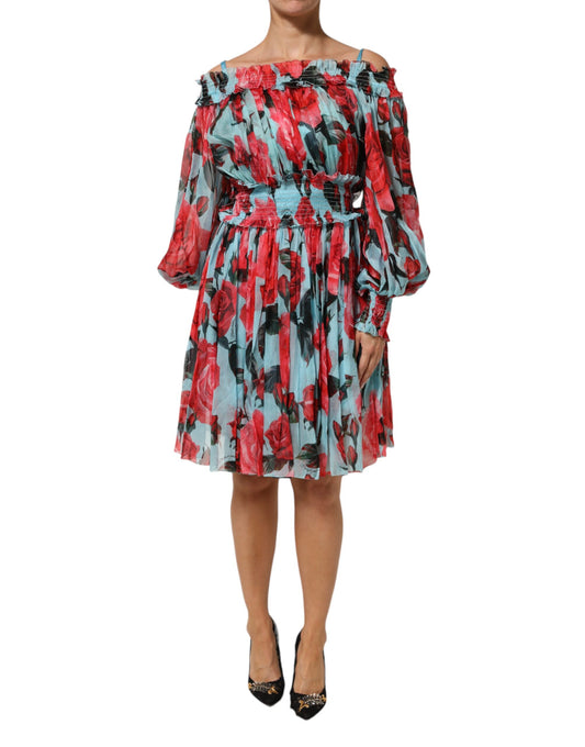 A woman wearing a multicolored floral chiffon dress with ruffled sleeves