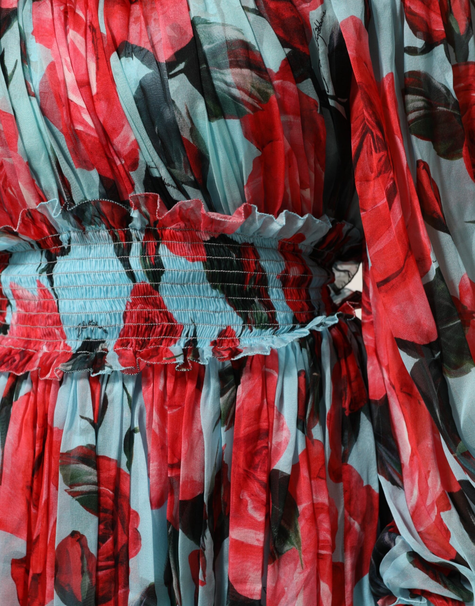 A red, black, and blue floral chiffon dress with ruffled sleeves
