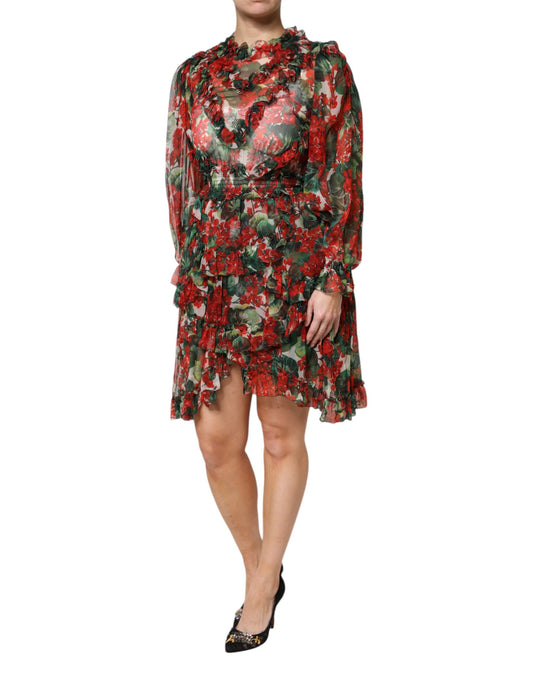 A woman wearing a long sleeve dress with floral and ruffle patterns