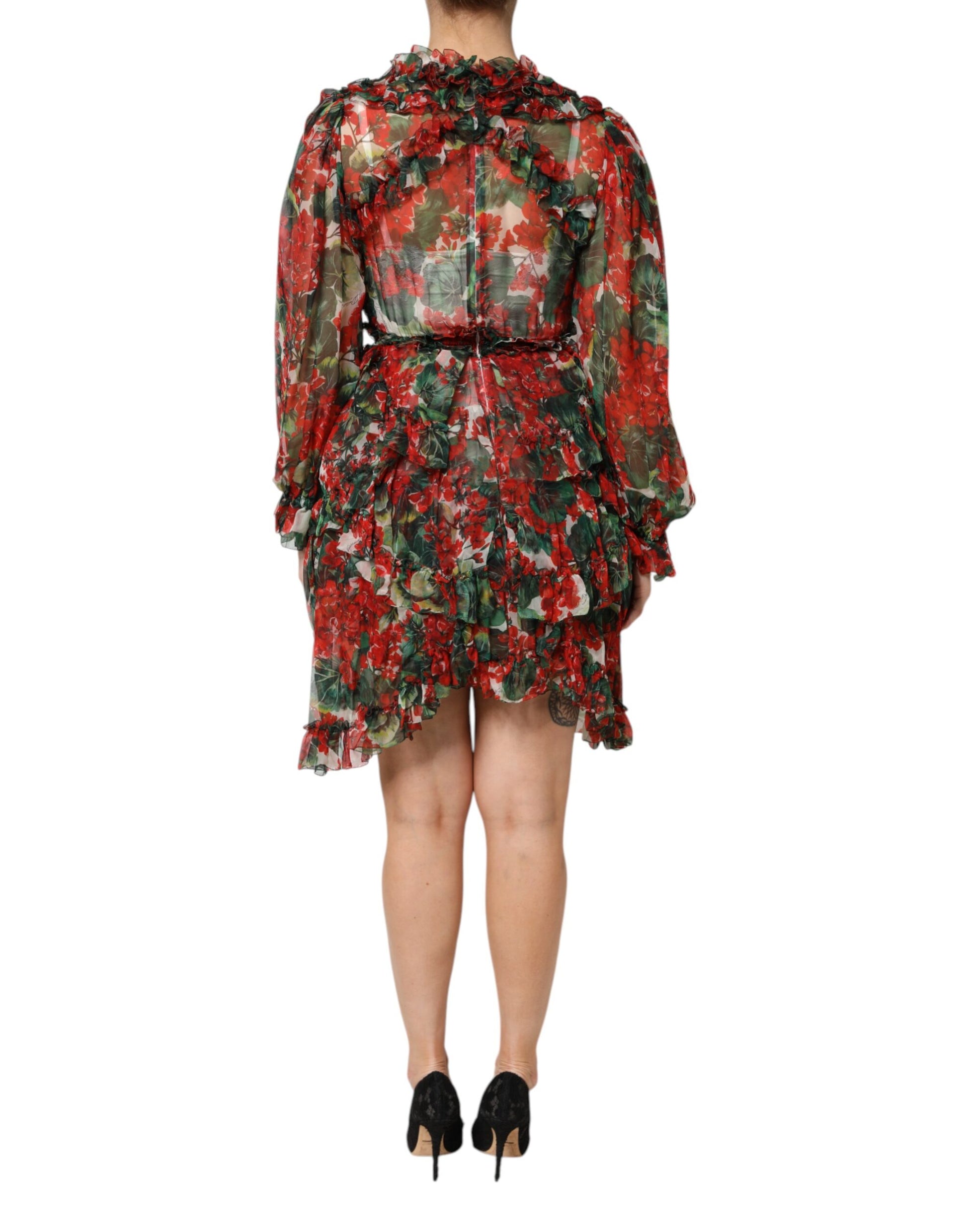 A long sleeve dress with a floral pattern and ruffles on the shoulders