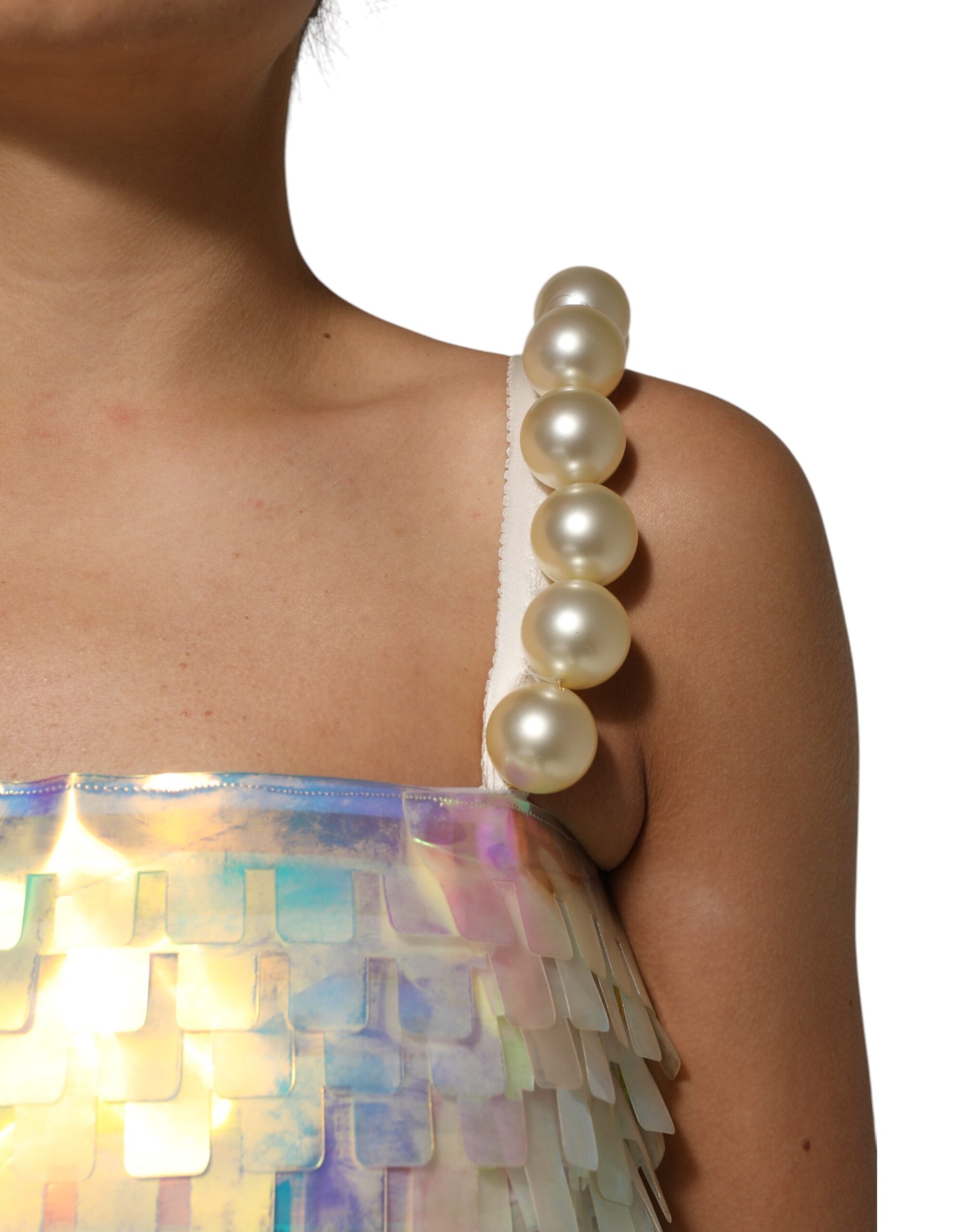 A woman wearing a multicolored sequin holographic mini dress
