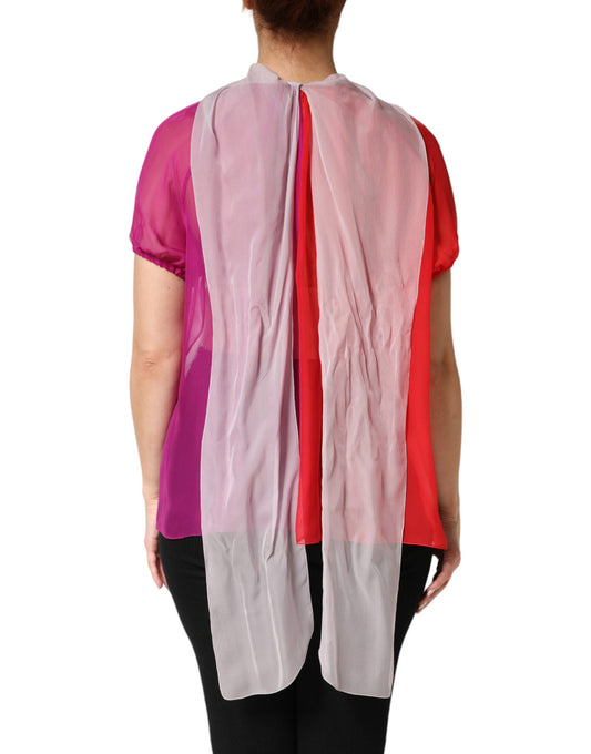 Pink, red, white scarf on woman's back