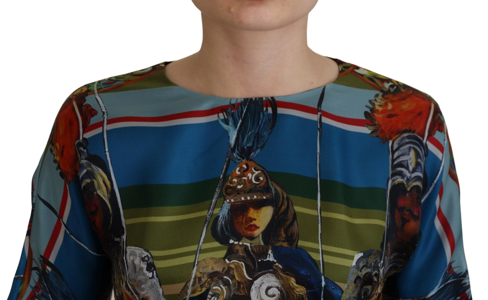 A person wearing a multicolored dress with a vibrant design. The dress features a silky texture and is adorne