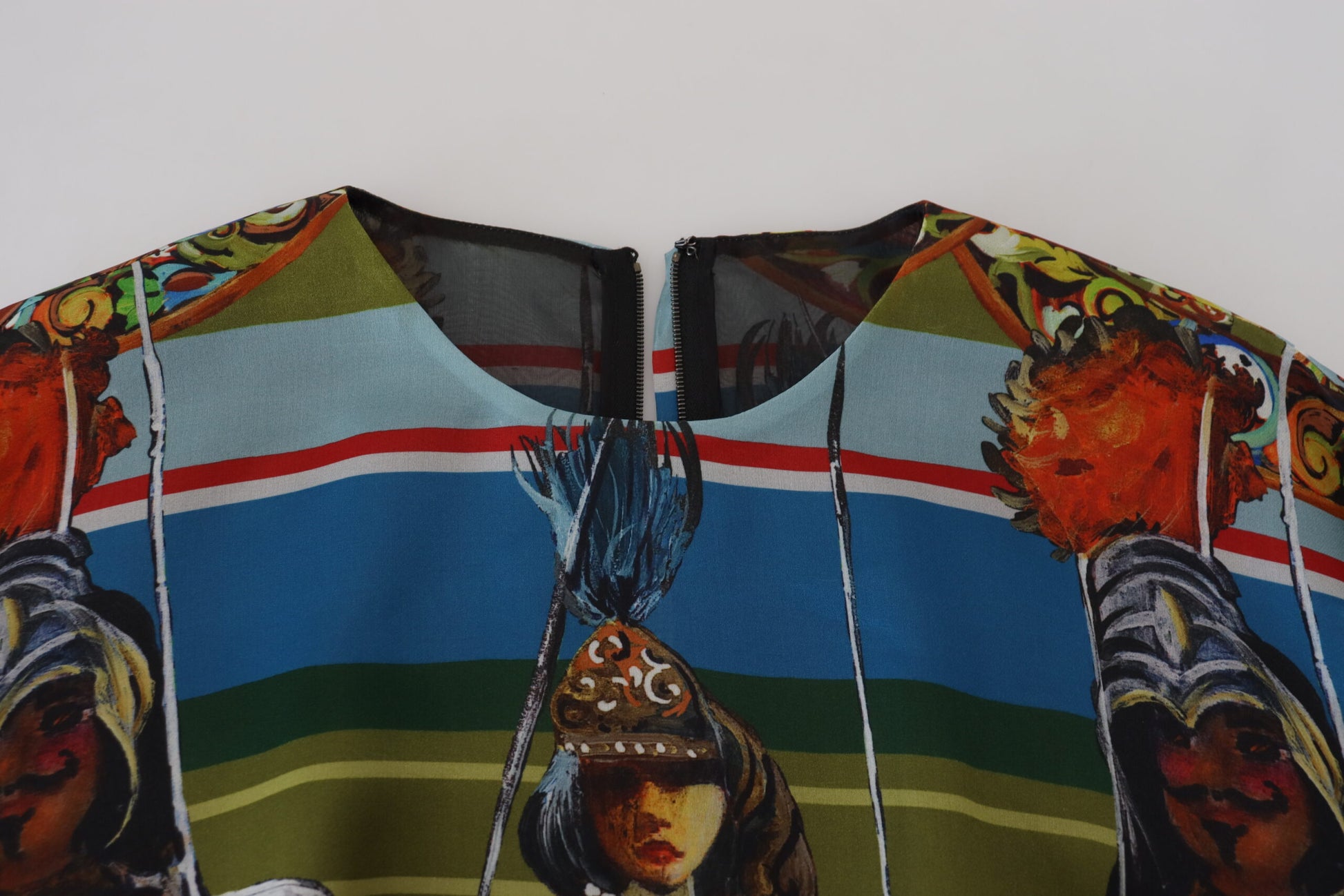Colorful silk dress with vibrant patterns and a portrait of a woman on the front