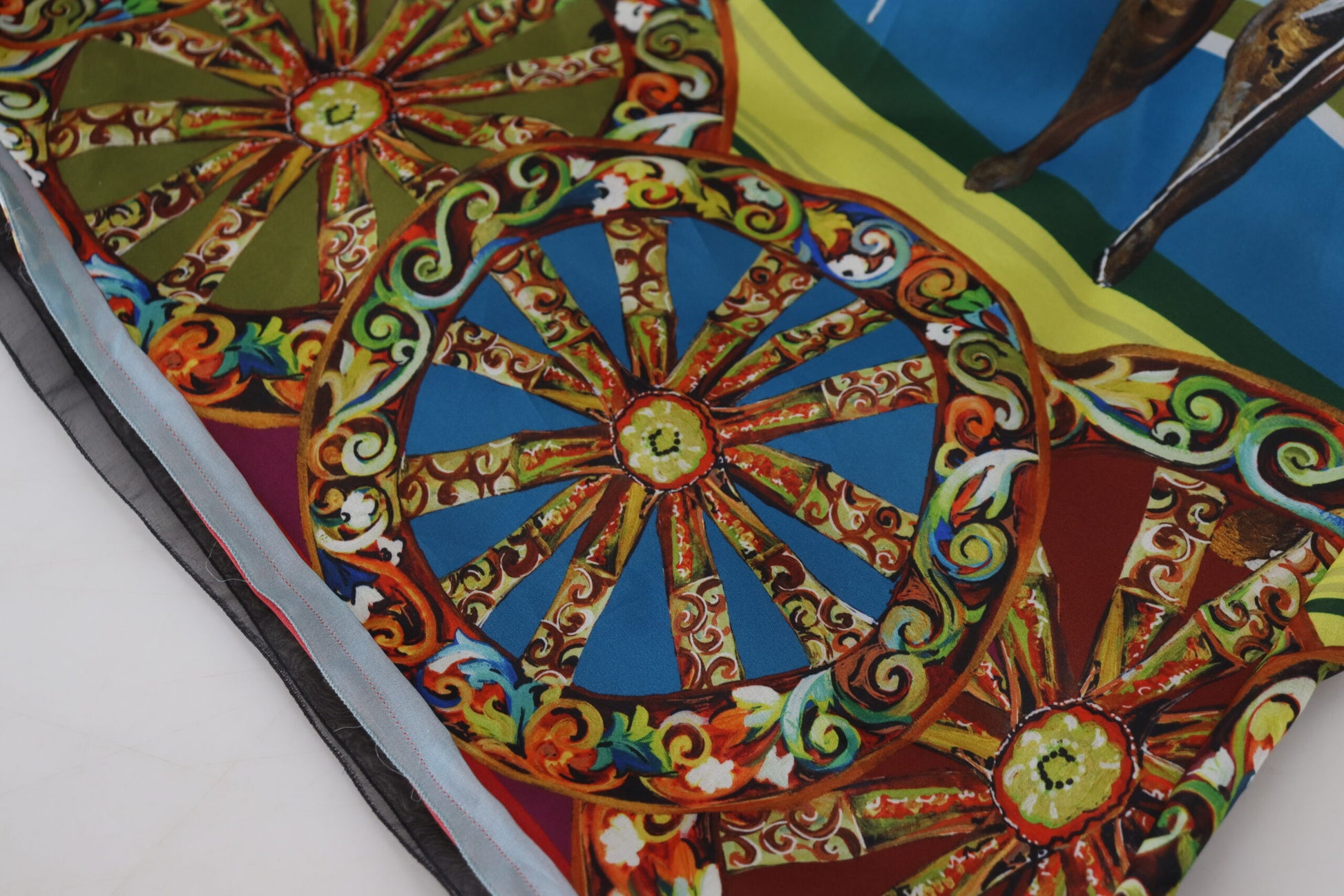 Colorful silk dress with intricate designs and embellishments, featuring a circular pattern at the center