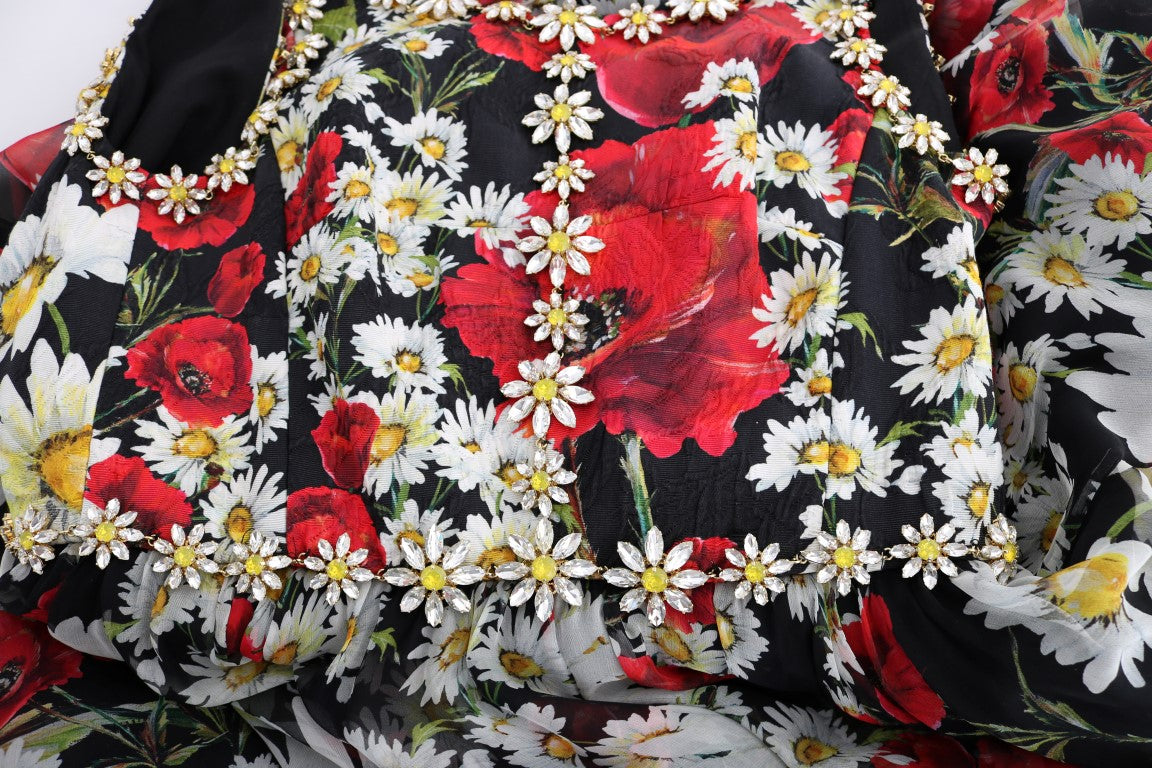 Floral patterned fabric with red flowers and white daisies on a black background