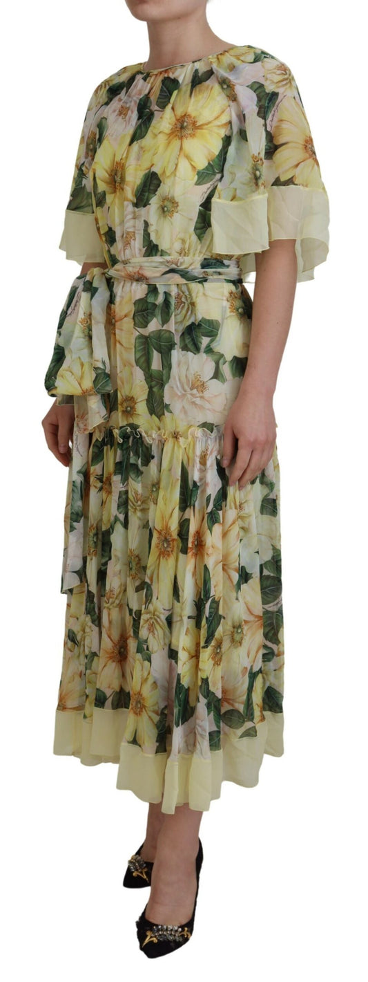 A long, flowing maxi dress with a floral print in shades of yellow and green