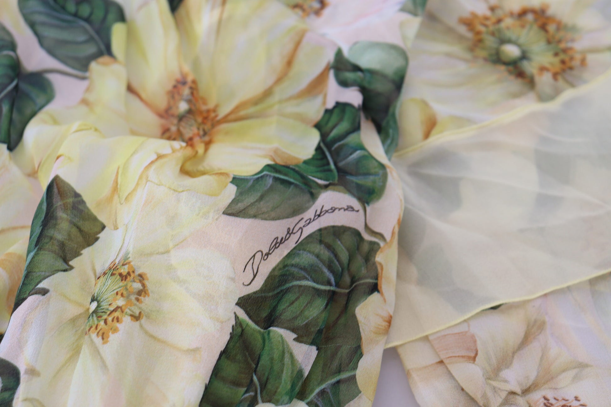 A long, multicolored silk dress with a floral print and lace detailing
