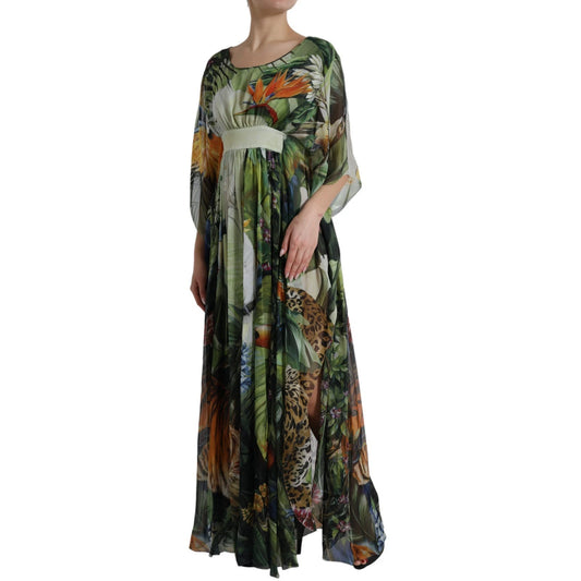 A long, flowing dress with a jungle print featuring various animal and plant designs