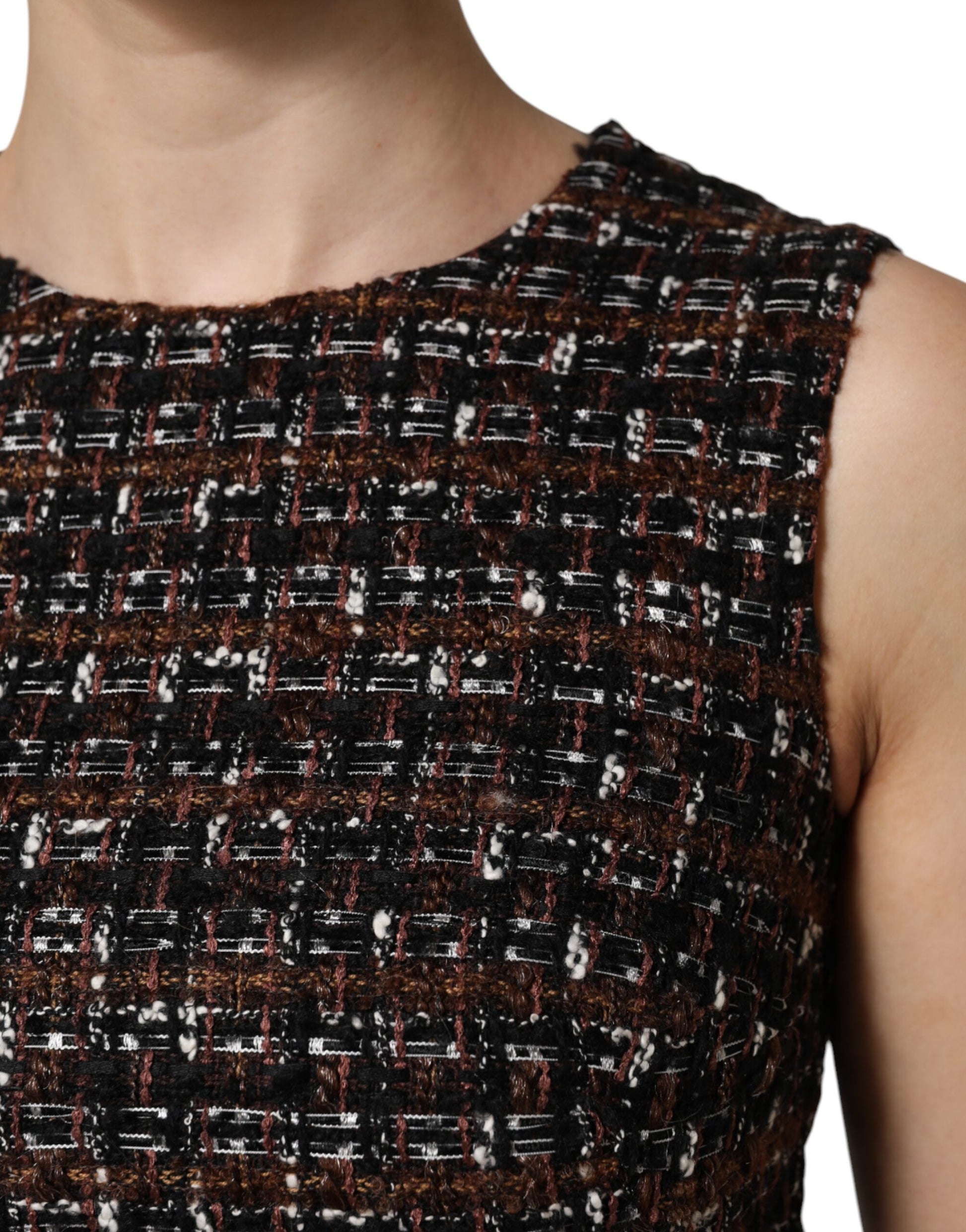 A sleeveless mini dress with a tweed pattern. It is designed by Dolce & Gabbana and features an A-line silhou