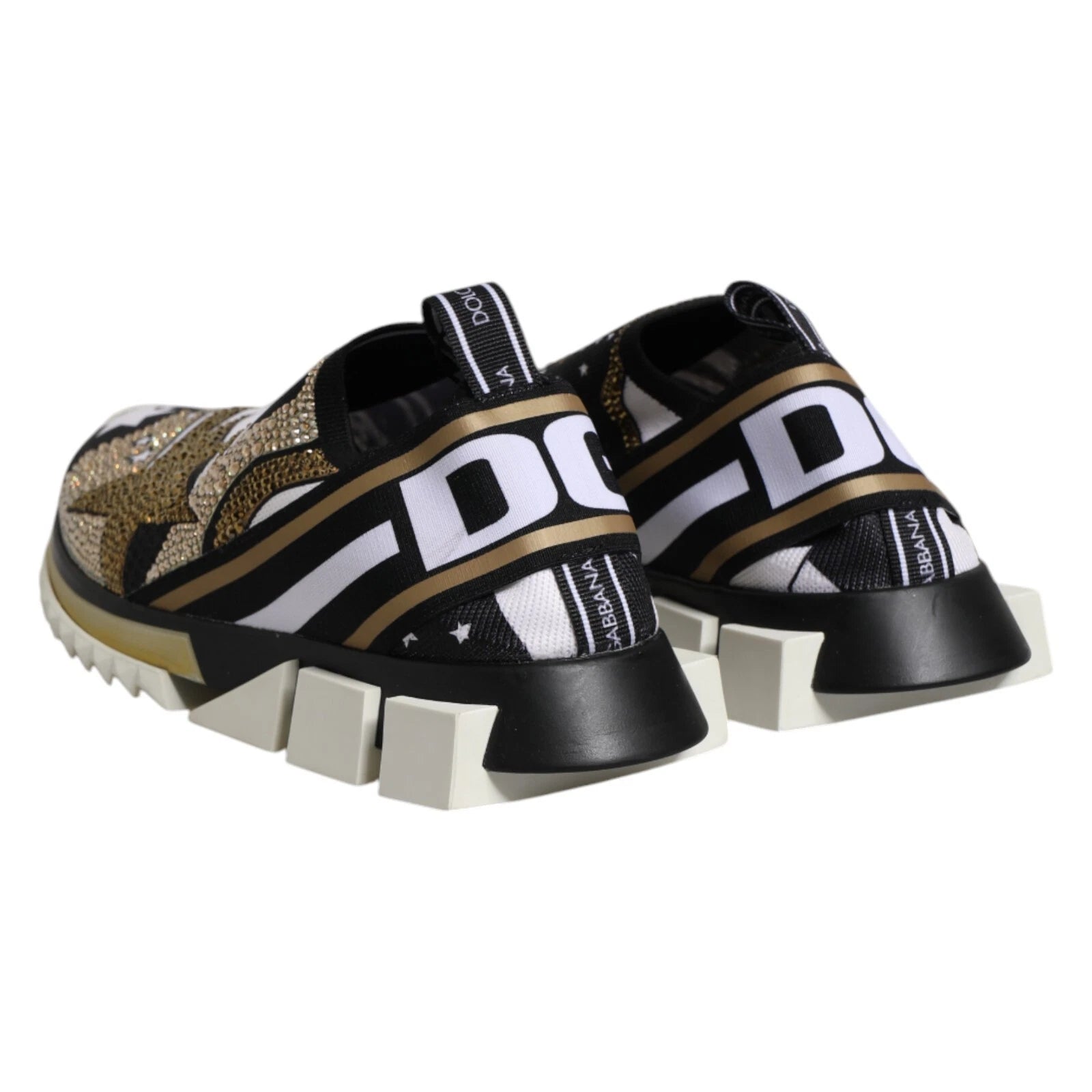 Pair of children's shoes with white soles and gold accents