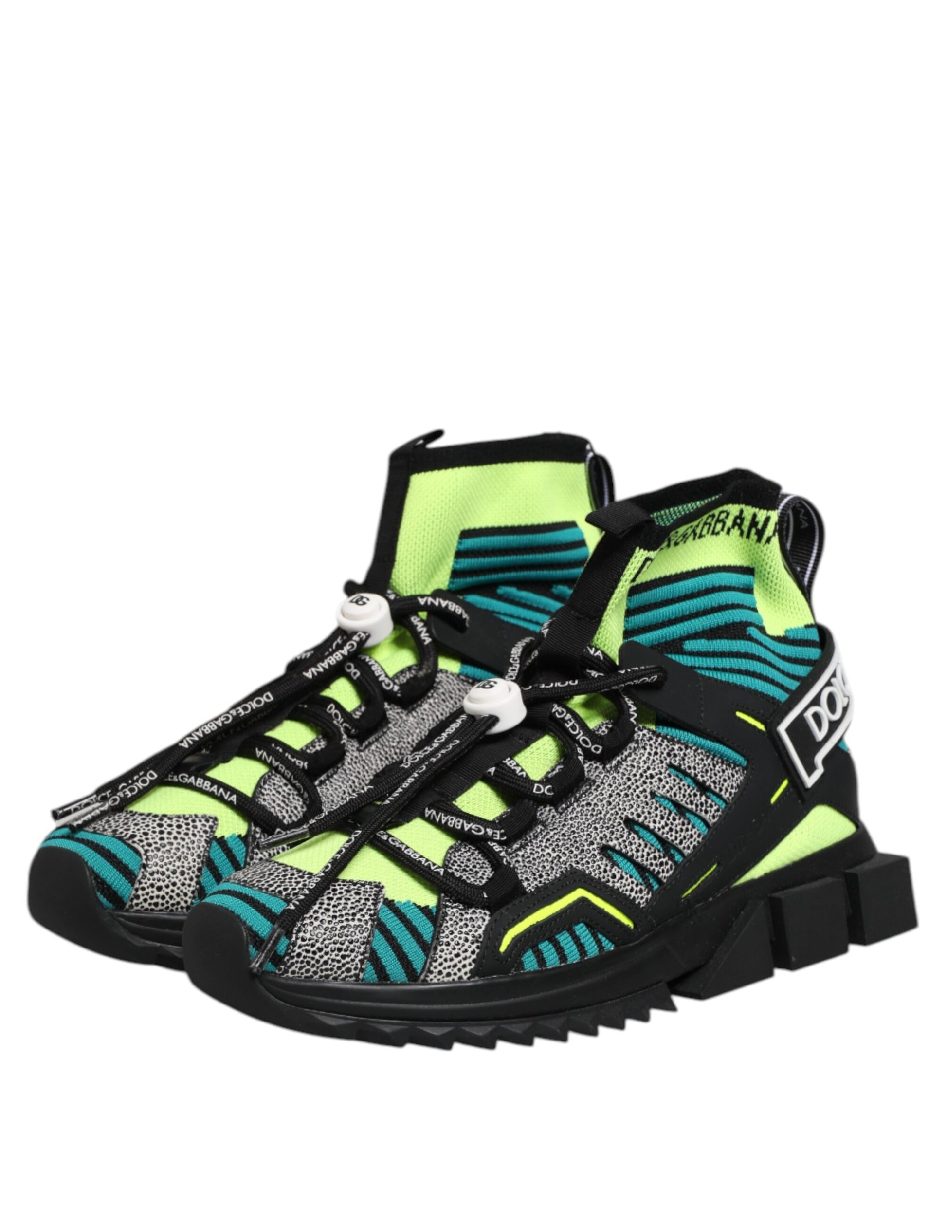 Shoe with laces, patterned design, black sole, white midsole, yellow and green accents