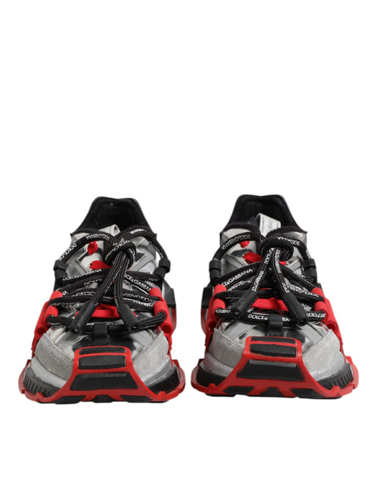 Pair of red and black athletic shoes