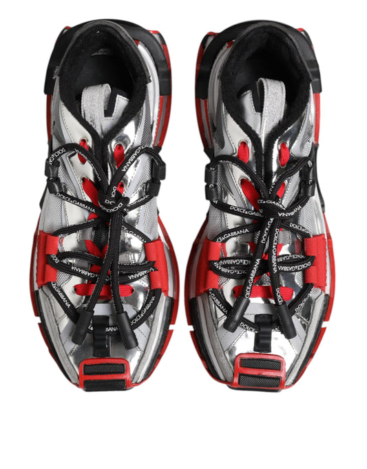 Pair of red and white athletic shoes