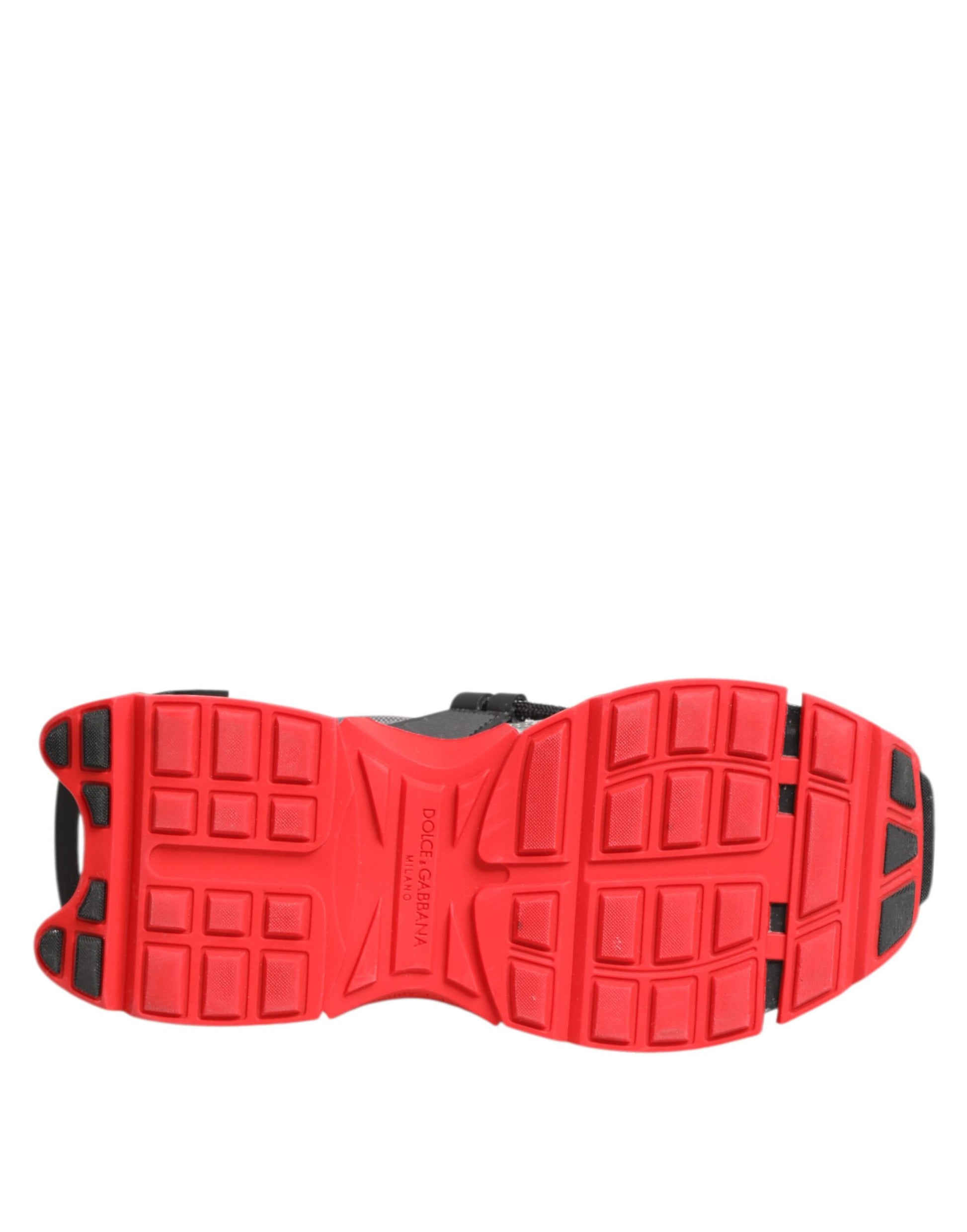 Red sneaker with black laces, white sole and multicolored design on top