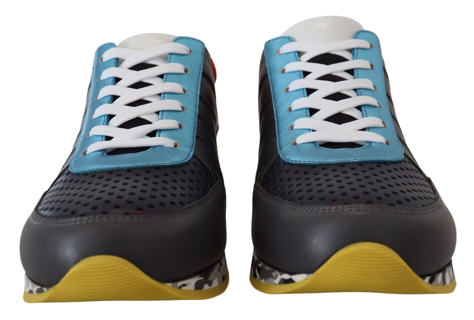 Pair of blue and yellow sneakers with white laces
