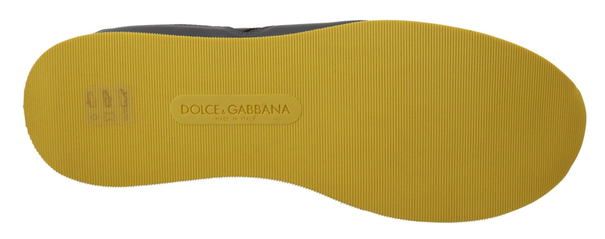 Yellow shoe with a gold buckle and label reading D&G Dolce & Gabbana