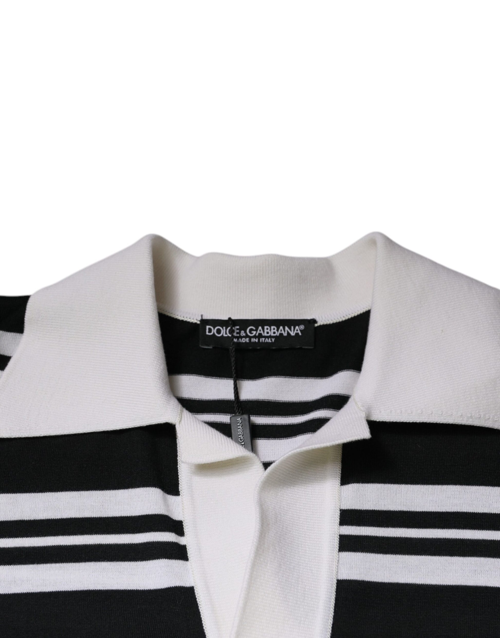White and black striped sweater on hanger