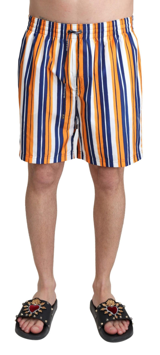 Men's swim trunks in orange, white, and blue stripes