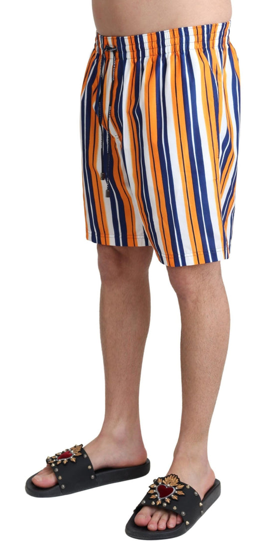 Man wearing striped shorts and sandals