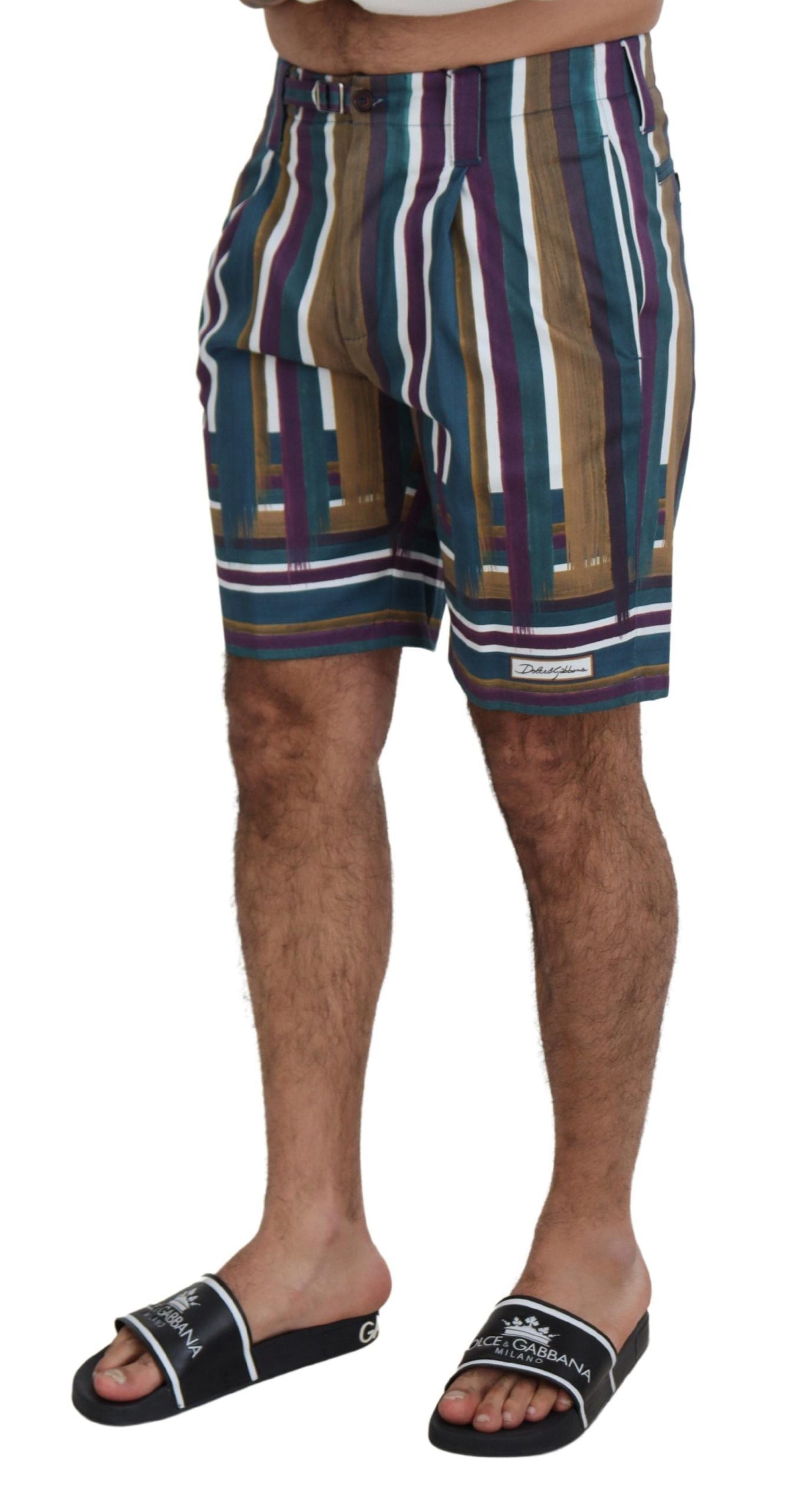 Man wearing striped shorts and sandals