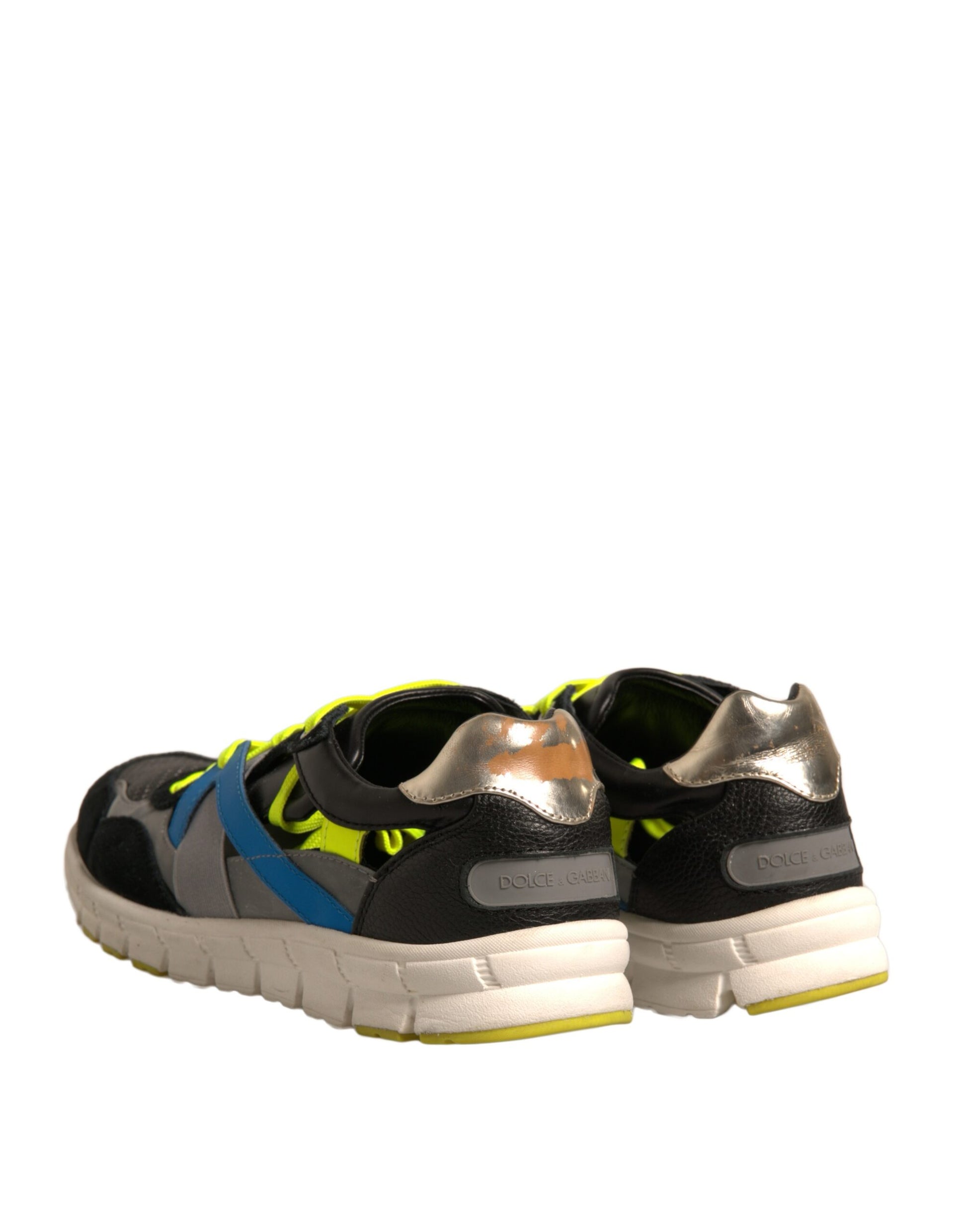 Pair of black sneakers with yellow accents