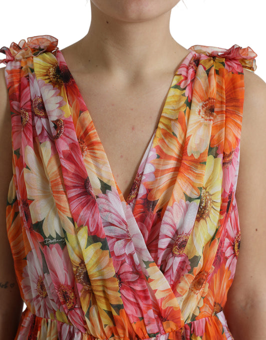 A woman wearing a multicolored sunflower print silk midi dress