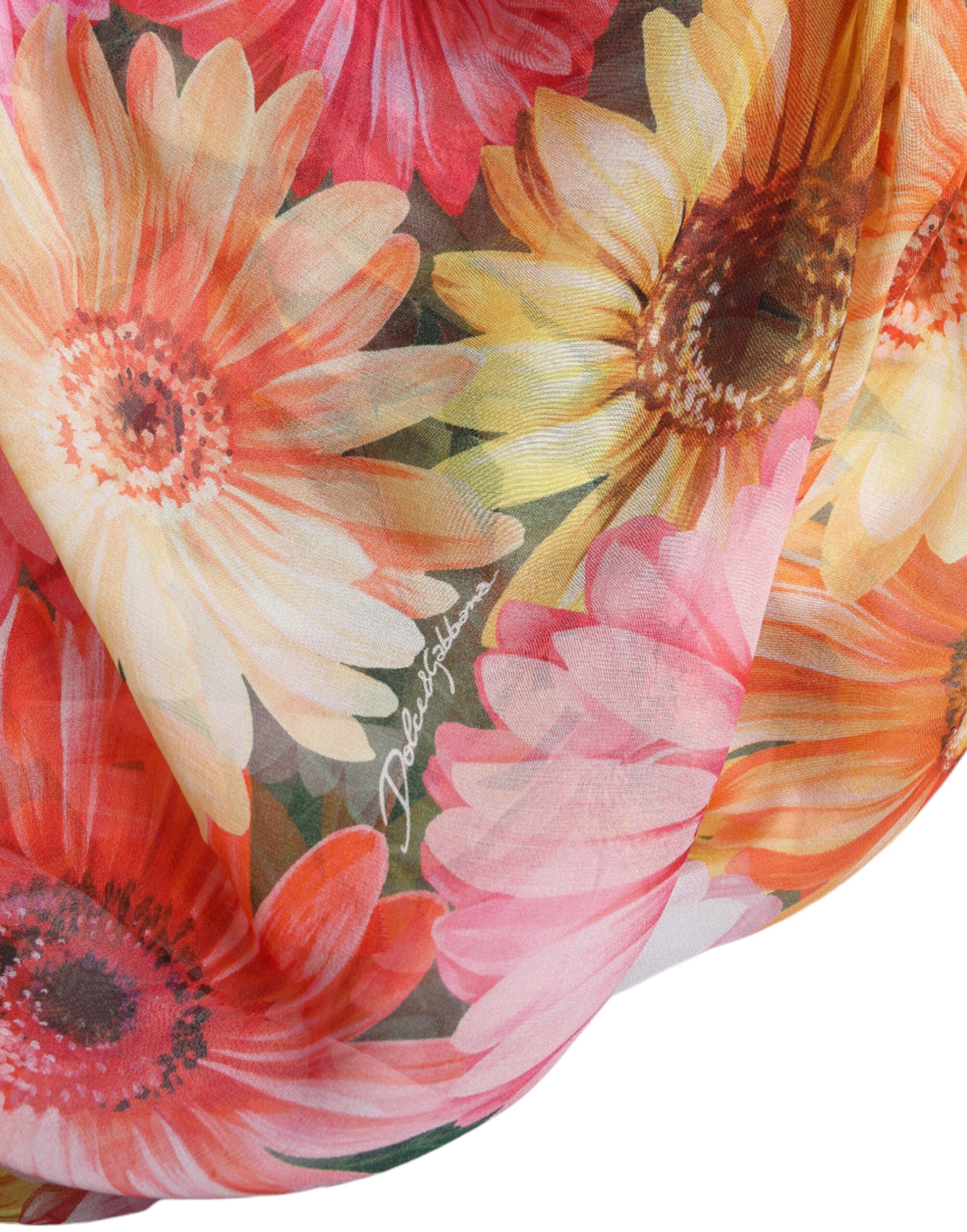 A multicolored silk midi dress with a sunflower print