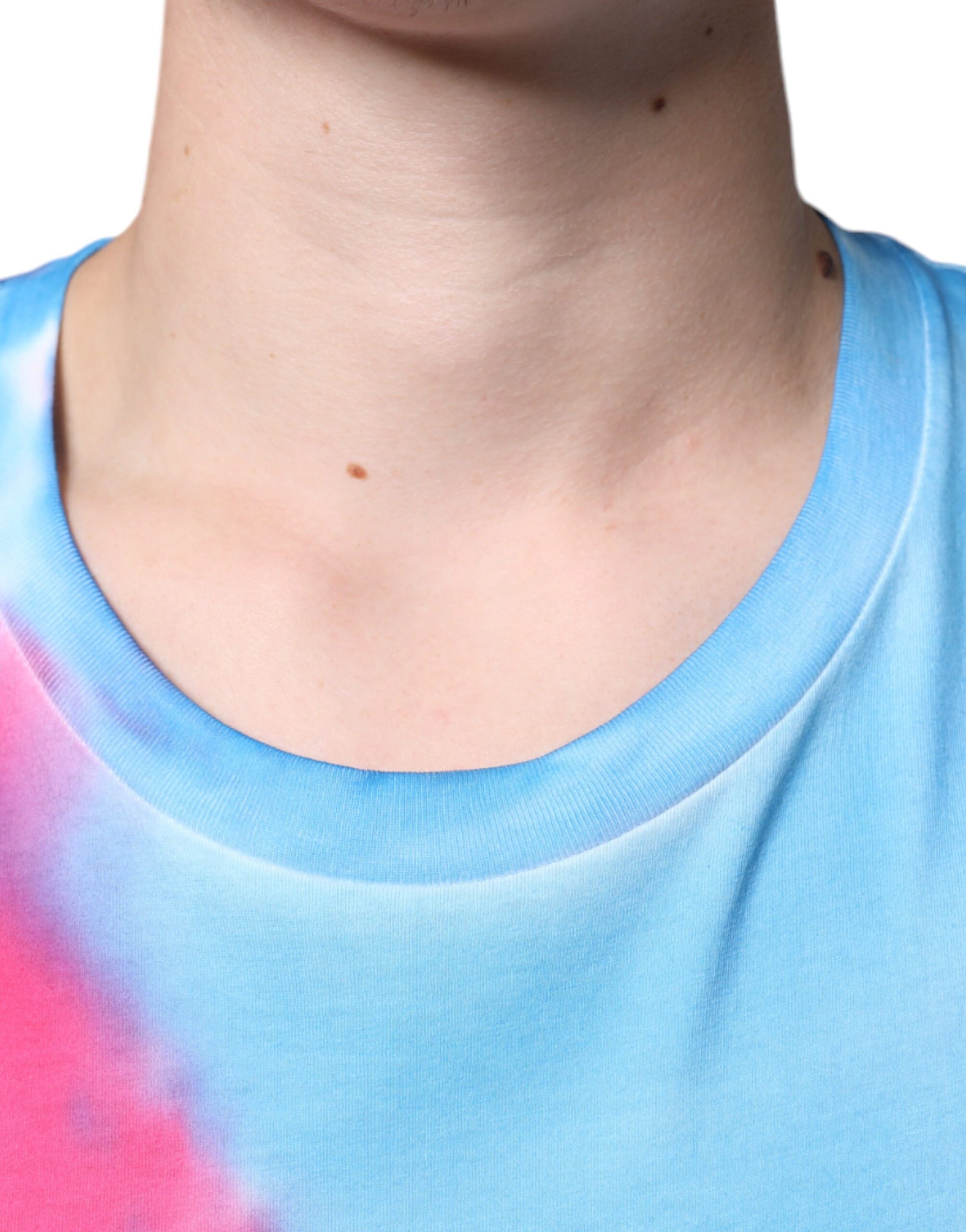 A person wearing a tie-dye t-shirt