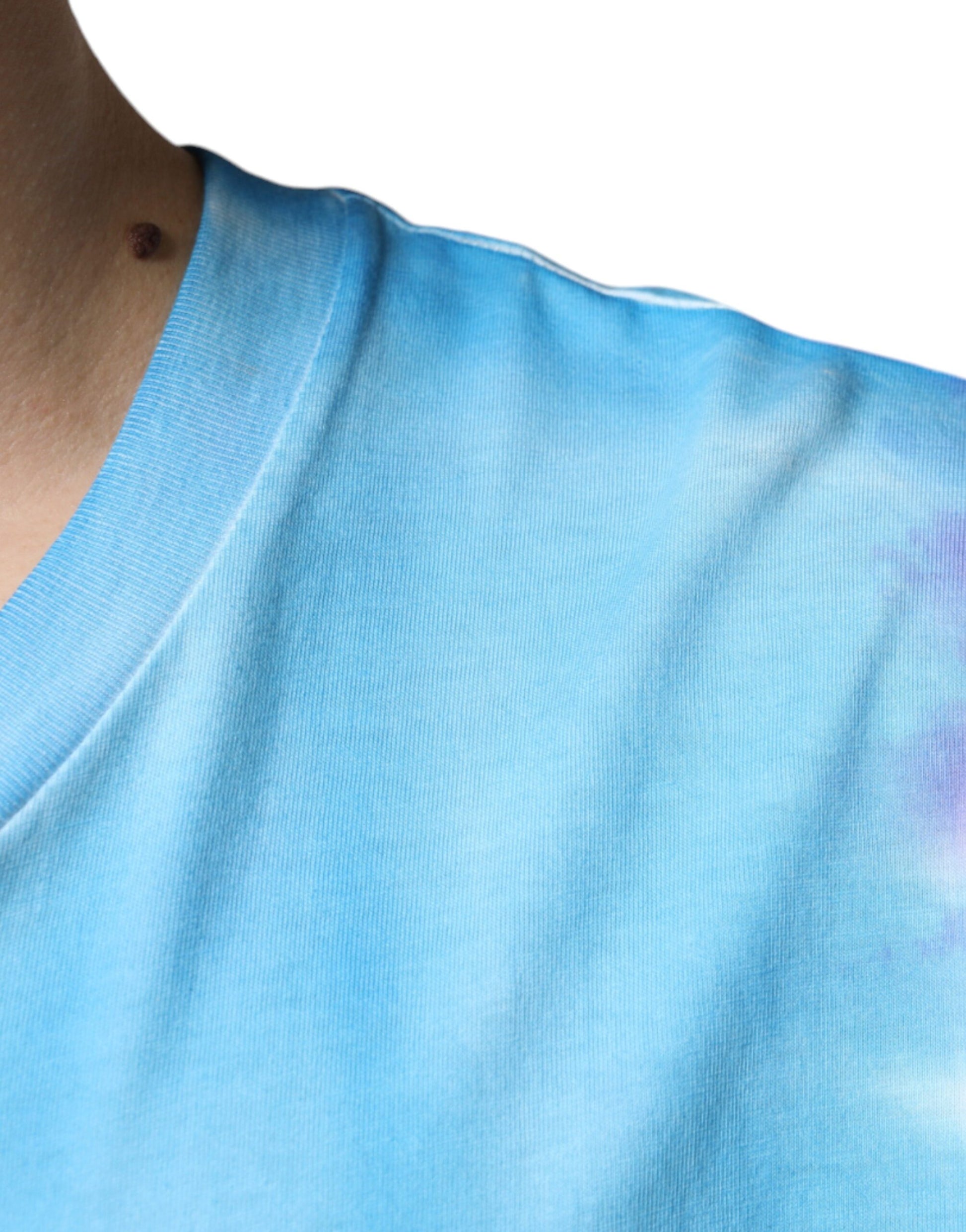 Blue sleeveless shirt on a person's shoulder