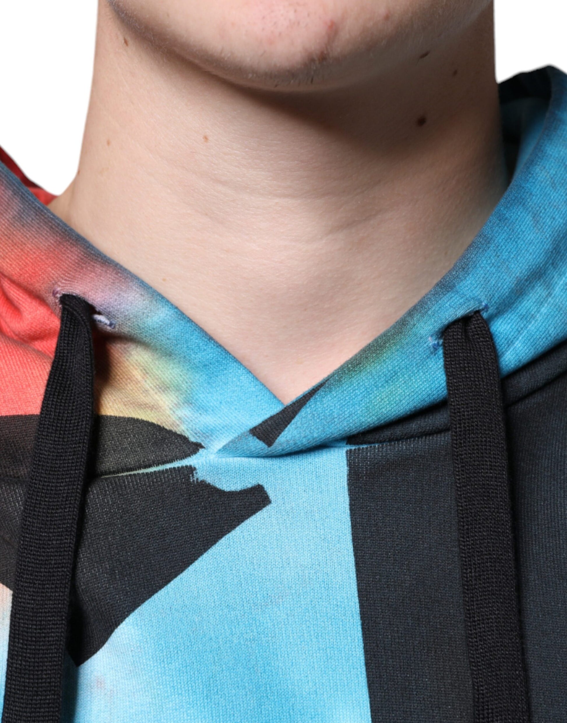 The hoodie is colorful with a tie dye pattern