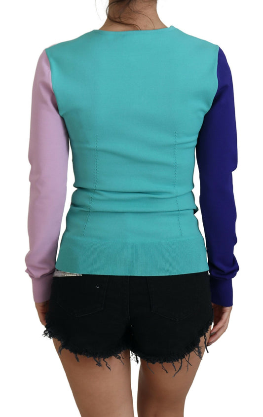 Woman wearing a colorful sweater vest over shorts