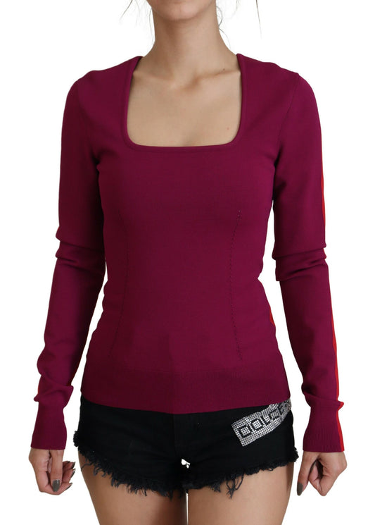 Woman wearing red sweater and black shorts