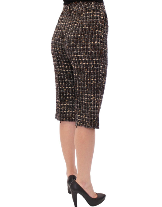 Woman wearing high waisted pants and black heels