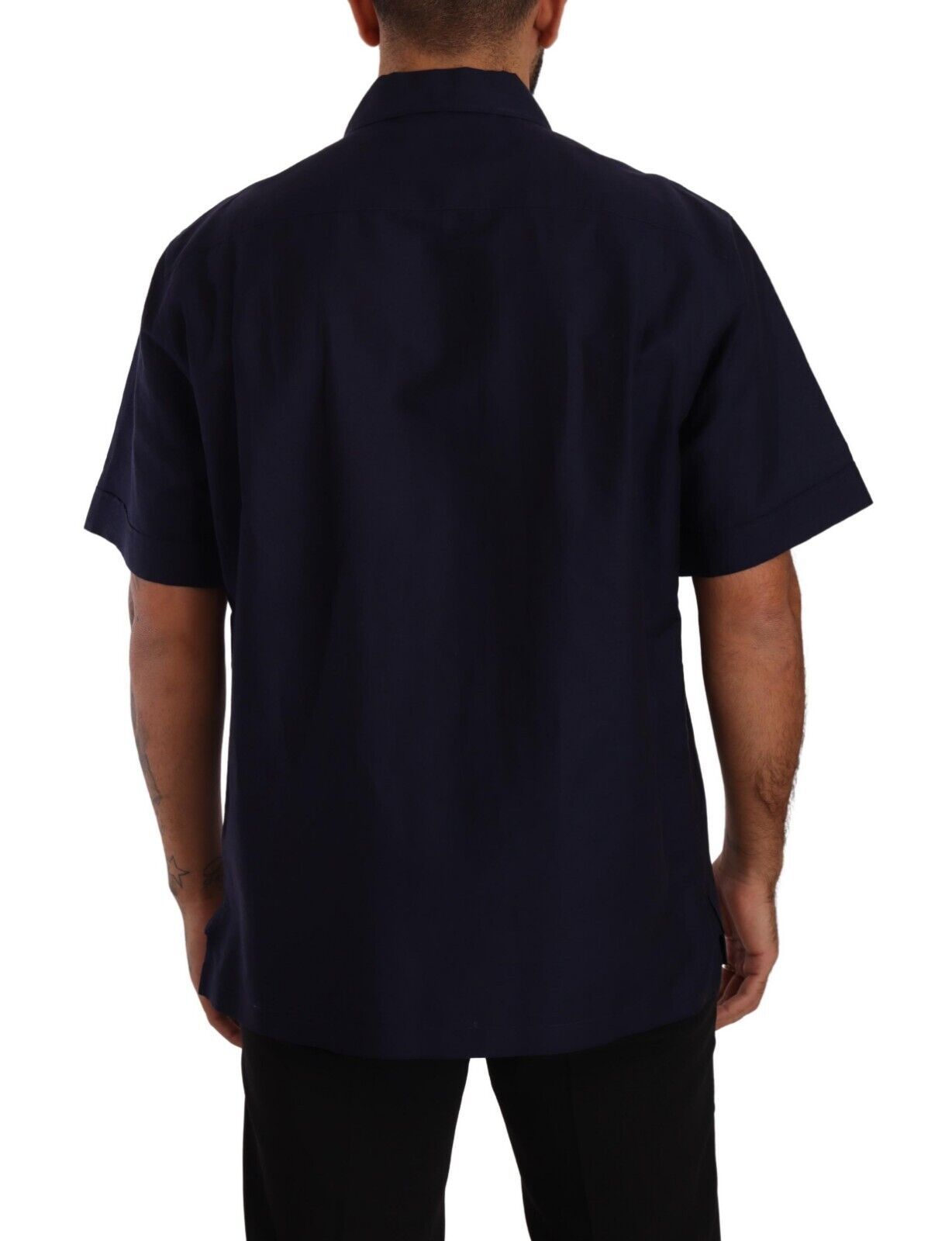 Man wearing dark blue short sleeve shirt